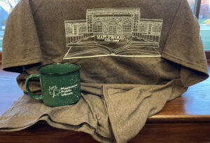 a green coffee cup on a brown blanket